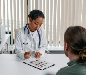 Doctor at a desk with paperwork