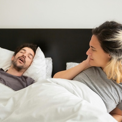 Angry woman and snoring male partner